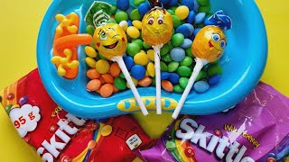 ASMR unboxing of jelly beans in a blue tub featuring playful lollipops [upl. by Hassin]