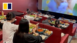 Moviegoers indulge in growing trend of ‘hotpot cinema’ [upl. by Auqined]