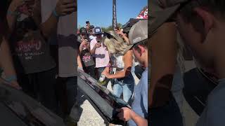 Lindsay Bercosky signing a tail gate with an angle grinder automobile [upl. by Anitnauq]