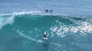 Foil surfing in front of the Uluwatu cliffs [upl. by Astto]