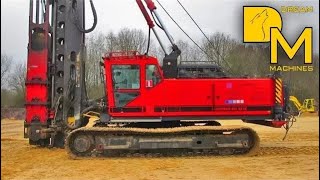 PILE DRIVER MACHINE WITH IMPACT HAMMER ERECTING CONCRETE FOUNDATIONS [upl. by Eenafets176]