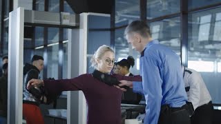 Airport Security Guard Checking Passenger Stock Video [upl. by Ymmat875]