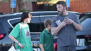 Ben Affleck carries a box of cigarettes while picking up his children in LA [upl. by Irik]