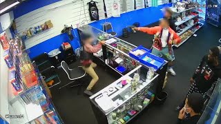 VIDEO Gun battle breaks out between store employee and wouldbe robbers [upl. by Lazar468]