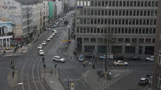 Busy intersection with yellow cabs taxis driving trough on cloudy day in Berlin Germany German taxi [upl. by Lubow106]