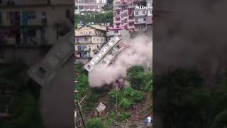 Multistory building collapses onto other homes [upl. by Feetal388]