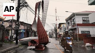 Typhoon Manyi blows off roofs and brings flooding to the Philippines [upl. by Leontyne112]