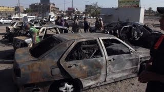 Iraqis inspect damage after car bomb attacks [upl. by Hook]