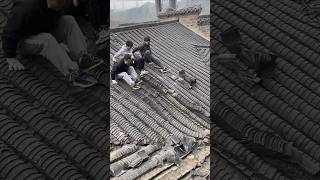 The process of manual removal of tiles from ancient building roofs [upl. by Marino]