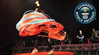 SPOTLIGHT  Most hula hoops spun simultaneously [upl. by Dlabihcra]