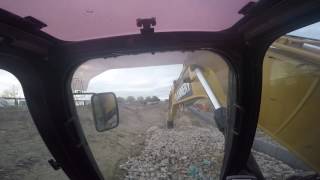 CAT 320E L excavator filling gabion baskets [upl. by Ihcas]