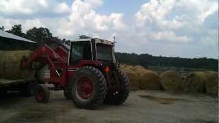 886 International tractor unloading hay 2012 RampM Farms [upl. by Idalla]