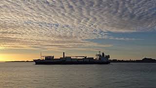 container ship sailing at sunset out of Portsmouth into the Solent [upl. by Ozner]