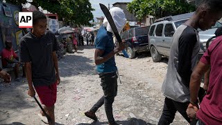 Vigilantes in Haiti strike back at gangsters with brutal street justice [upl. by Toffic]