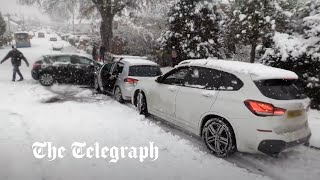 Snow chaos Out of control cars crash amid further weather warnings [upl. by Weinman275]