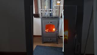 Freestanding steel wood stove  Powerful 26kW heating connectable to central heating system [upl. by Nelav]