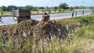 Nice landfill with bulldozer filling up land in action and dump trucks [upl. by Notgnilra]