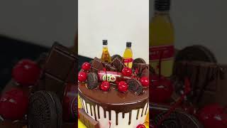 Chocolate drip cake with bottles Oreos cherries cakedesign icingcake fruit johnywalker cake [upl. by Agna634]