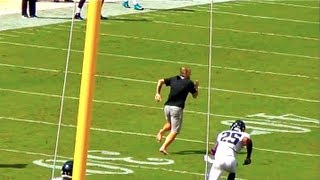 FAN RUNS ONTO FIELD amp RUN DOWN BY FOOTBALL PLAYER [upl. by Oalsinatse]