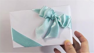 How to tie diagonal ribbon bow on gift wrapping box  禮物盒斜綁蝴蝶結的打法 bowMaking on gift box [upl. by Osnofledi615]