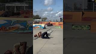 Skateboarder attempts 5050 grind from rail at skatepark then falls forward and lands on chest [upl. by Nicolais]