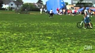 13 injured when bounce houses go airborne in New York [upl. by Chouest]