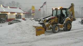 Cat 420E Backhoe Plowing Snow with ProTech pusher [upl. by Girardo]