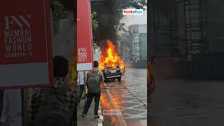 A moving car suddenly emitted smoke before bursting into flames at Bandra Kurla Complex [upl. by Gerek292]