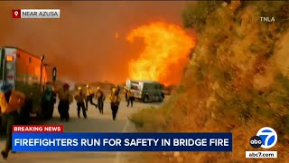 Firefighters run from flames as wildfire advances in Angeles National Forest [upl. by Haley]