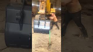 Locking pin installation process for replacing the bucket of the excavator [upl. by Rumpf139]