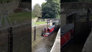 Silsden hire boat departs the locks at Gargrave heading towards Skipton on the Leeds Liverpool canal [upl. by Temhem]