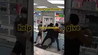 Thief distracts phone shop owner while thugs rob shop [upl. by Kaden]