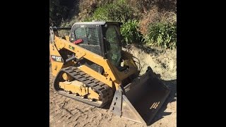 Caterpillar 259D Skidsteer topsoiling slope [upl. by Amada]