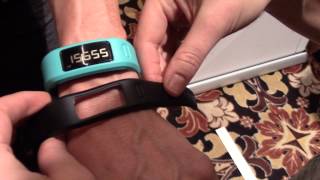 Hands on with the Garmin vivofit at CES 2014 [upl. by Leahci]