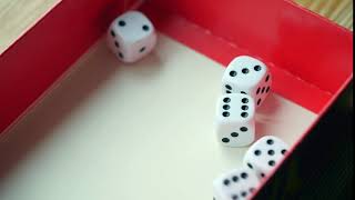 Playing yatzy rolling five dice in slow motion Free HD video footage [upl. by Ettennaj62]