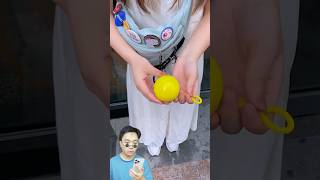 Fun Review on Outdoor Portable Raincoat Ball Disposable Rainwear Keychain [upl. by Eedyah]