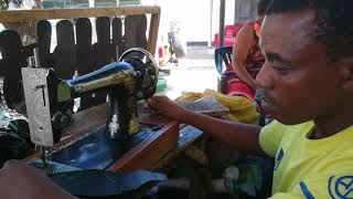 Disabled Cobbler in Tanzania uses Singer Sewing machine [upl. by Laurentia]