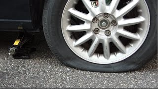 How To Change A Flat Tire Like A Boss [upl. by Nilats]