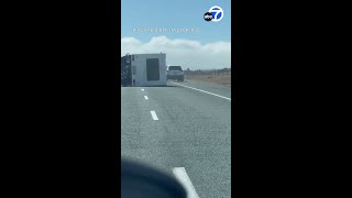 Car swerves to avoid toppled motorhome during strong winds in New Zealand [upl. by Amor172]