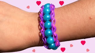 Loom armbandjes maken met kralen op een vork [upl. by Ilrebmyk]