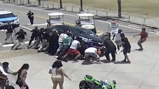 Good Samaritans Race to Lift Car off Motorcyclist [upl. by Marcel]