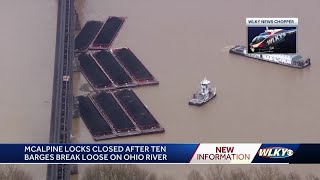 2 barges partially submerged after 10 break loose on Ohio River get stuck at bridge [upl. by Wendin249]