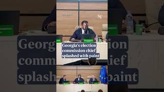 Paint thrown at Georgia’s election chief as ruling party confirms victory [upl. by Ahsiek]