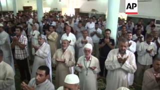 Shia muslims hold prayers to mark EidalFitr festival [upl. by Yniatirb480]