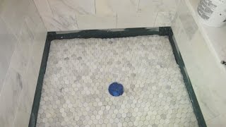 Marble Carrara Tile bathroom Part 5 Installing the shower floor [upl. by Meir]