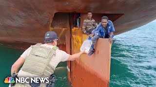 Watch 4 stowaways rescued from ships rudder after crossing the Atlantic [upl. by Inattirb]