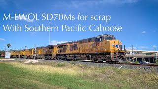 UP AC45CCTE 8011 South leads a MEWOL into Olmito Tx with SD70Ms for scrap and a SP caboose [upl. by Elletnwahs]