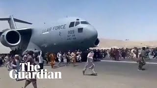 Afghans climb on to plane during takeoff in attempt to flee Taliban [upl. by Aloisius]