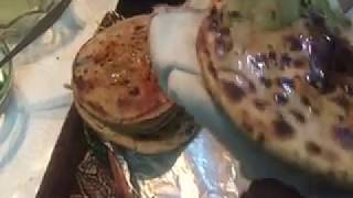 How to make Paratha Or Tandoori Roti on a Clay Tawa [upl. by Nerek]