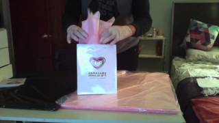 How to properly stuff tissue paper into a gift bag for a corporate event [upl. by Enimzzaj]